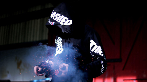 Smoke, anonymous mask, sparklers