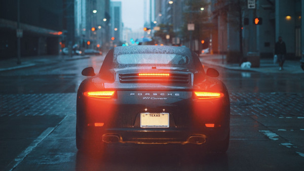 Porsche 911 Carrera on rainy streets