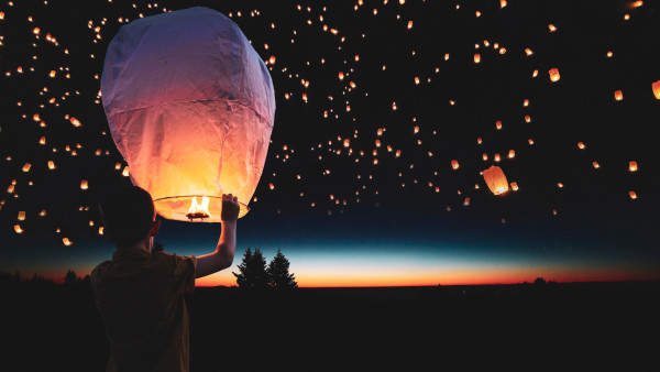 Lanterns floating on the night sky